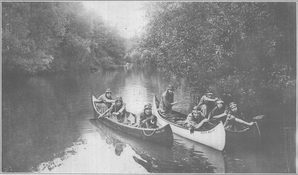 1921 girls paddling in a Penn Yan Boat Company canoe. 1921 girls paddling in a Penn Yan Boat Company canoe.